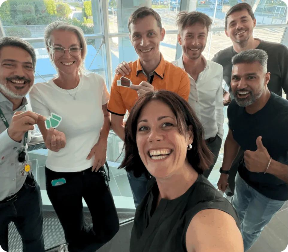 Qonic team members taking a group selfie with members of the partnership program.